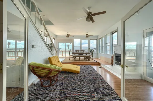 a living room with furniture and a rug