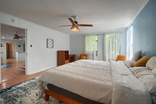 a bathroom with a bathtub sink vanity and mirror