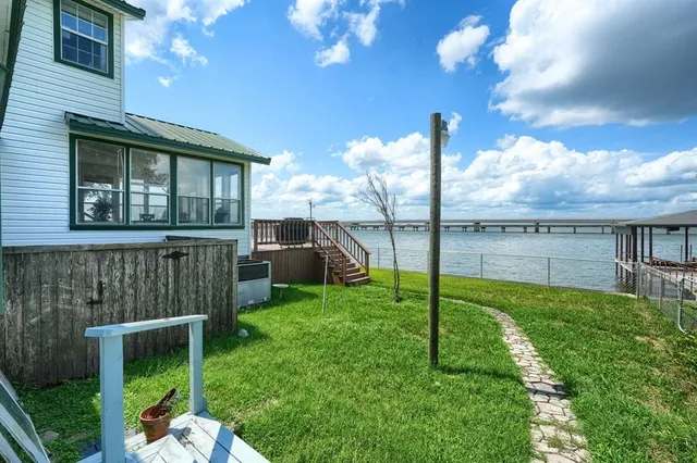 a view of a lake with a yard