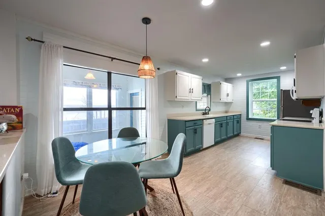 a kitchen with cabinets a sink and dishwasher