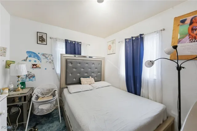 a bedroom with a bed and furniture