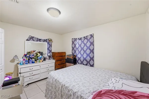 a bedroom with a bed and closet