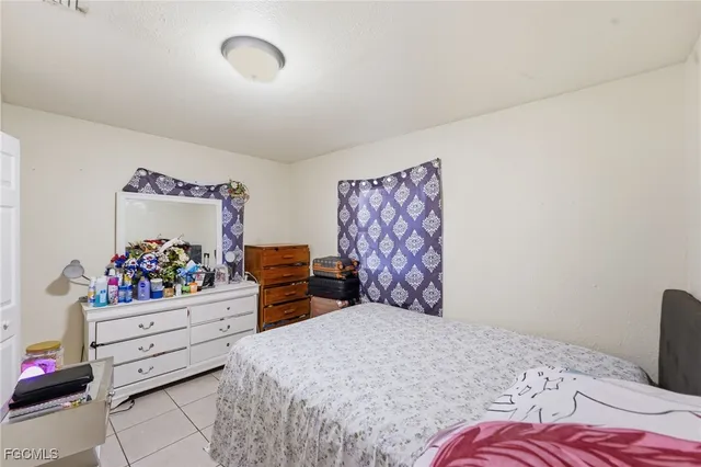 a bedroom with a bed and closet