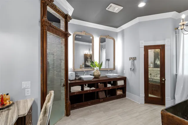 a view of hall way with furniture and bathroom