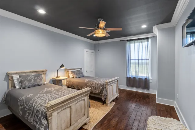 a bedroom with double bed and a window