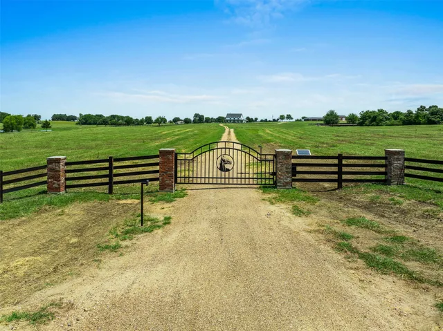 a view of a green field with clear sky
