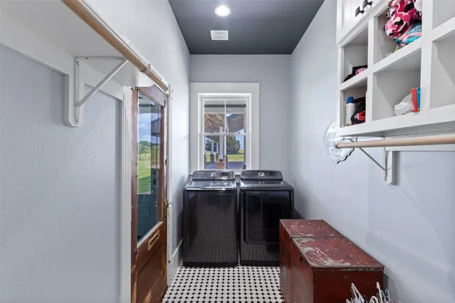 a living room with a rug and a window