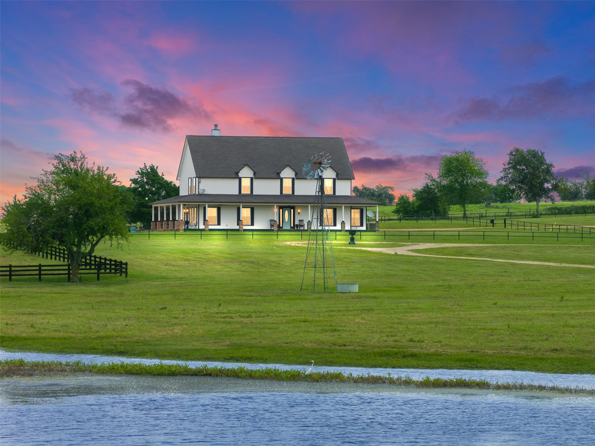 1725 Stokes Road New Ulm, TX 78950 - Photo 3 of 50 a front view of a house with a garden
