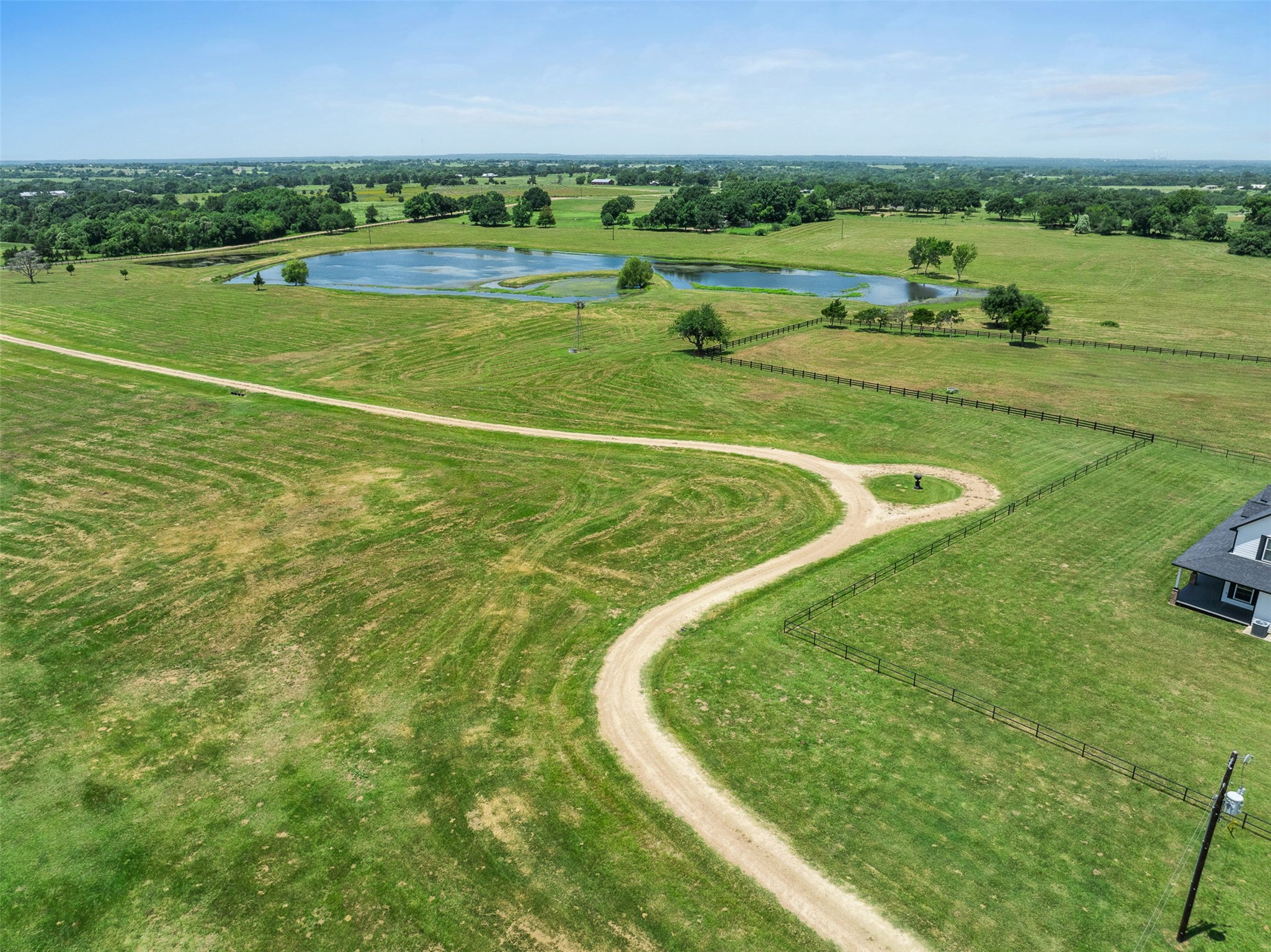 1725 Stokes Road New Ulm, TX 78950 - Photo 6 of 50 an aerial view of a golf course with a big yard