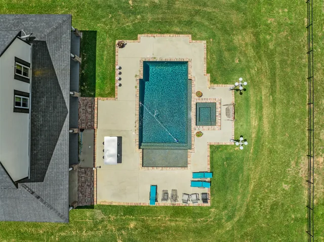 aerial view of a house with a yard