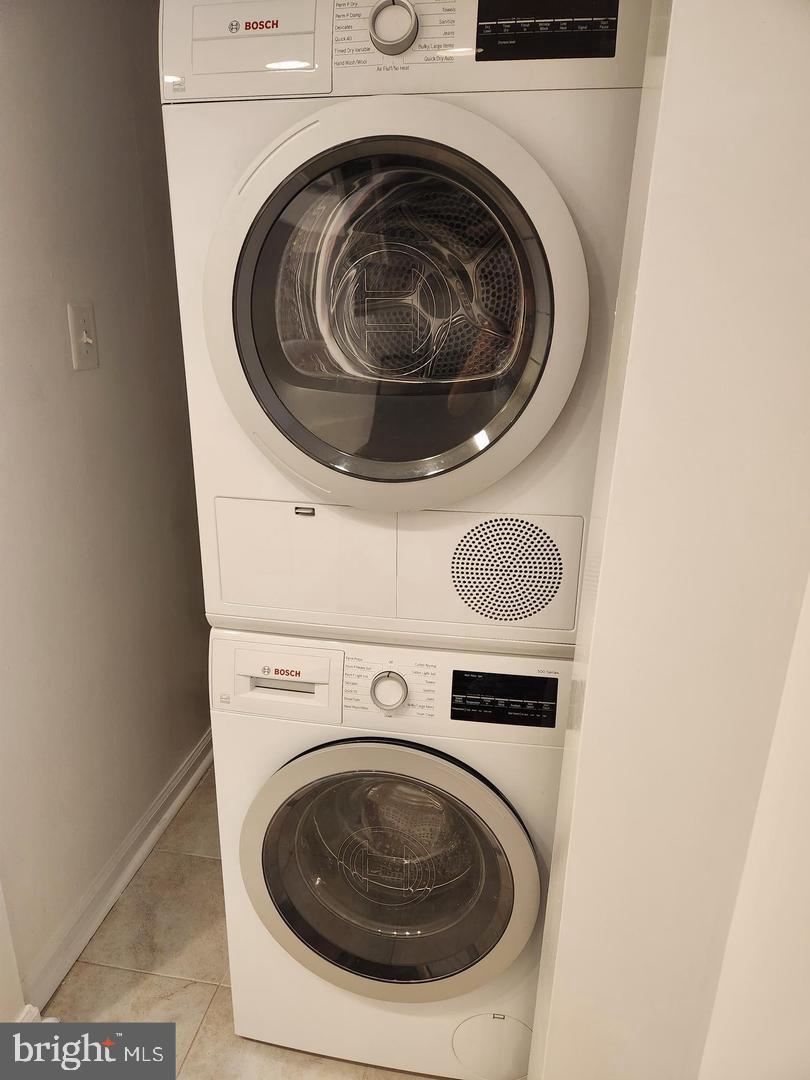 2725 Connecticut Avenue Northwest, Unit 406 Washington, DC 20008 - Photo 11 of 24 a utility room with dryer and washer