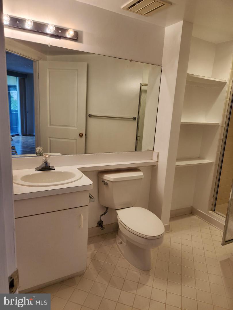 2725 Connecticut Avenue Northwest, Unit 406 Washington, DC 20008 - Photo 22 of 24 a white toilet sitting next to a bathroom sink