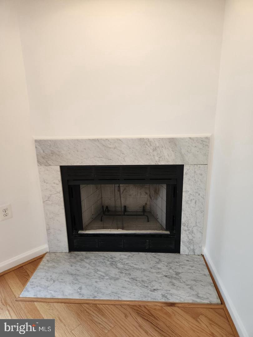 2725 Connecticut Avenue Northwest, Unit 406 Washington, DC 20008 - Photo 5 of 24 a living room with a fireplace