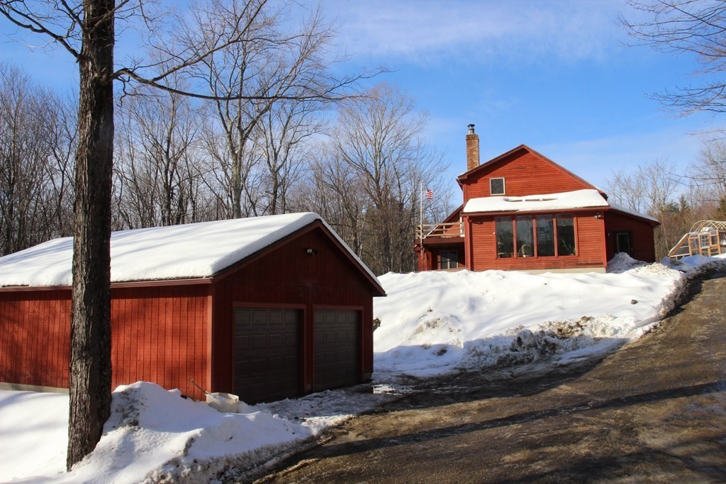 284 John Ford Road Ashfield, MA 01330 - Photo 8 of 40 a front view of a house with a yard