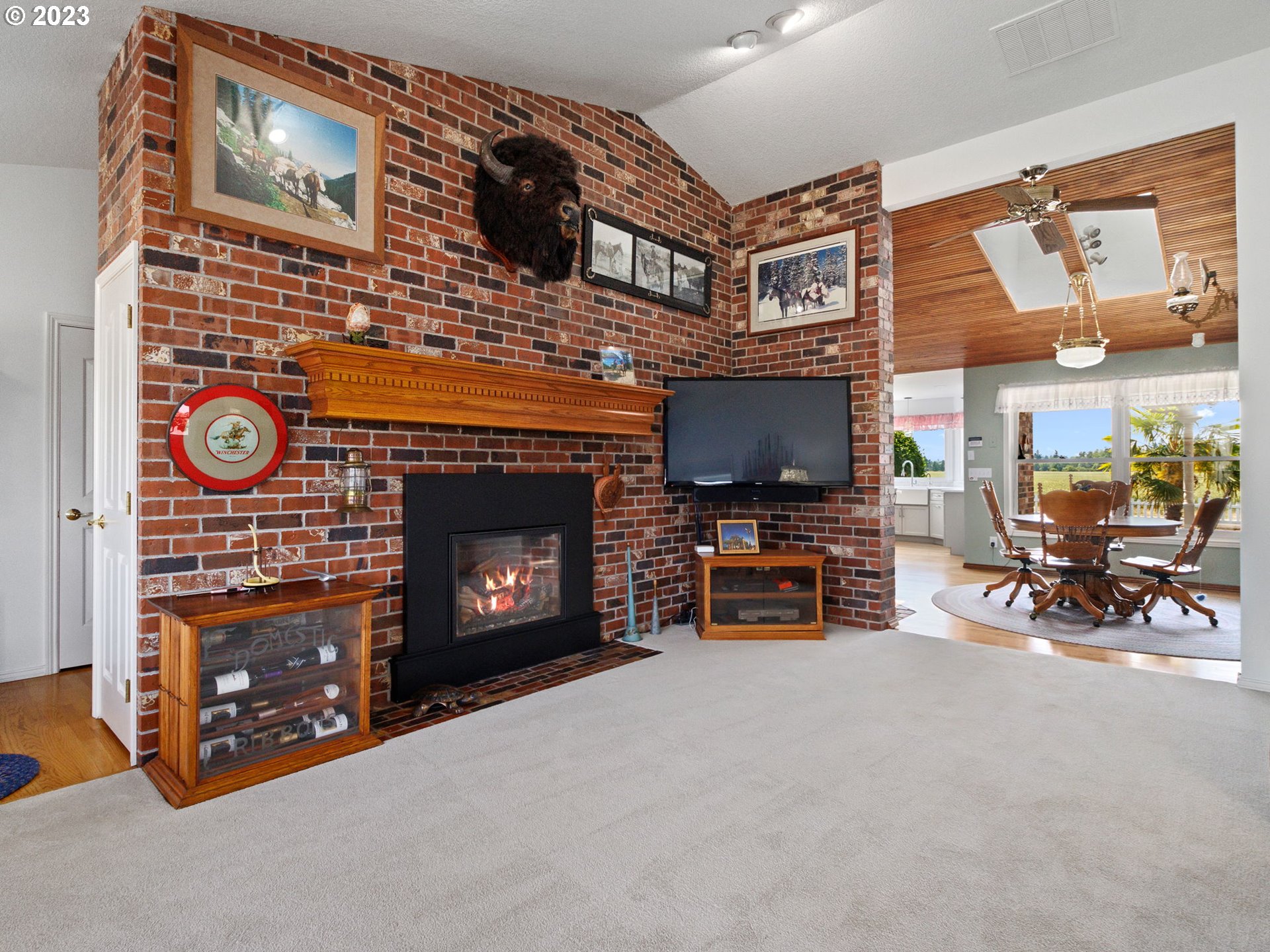 29600 South Dryland Road Canby, OR 97013 - Photo 11 of 48 a living room with furniture a flat screen tv and a fireplace