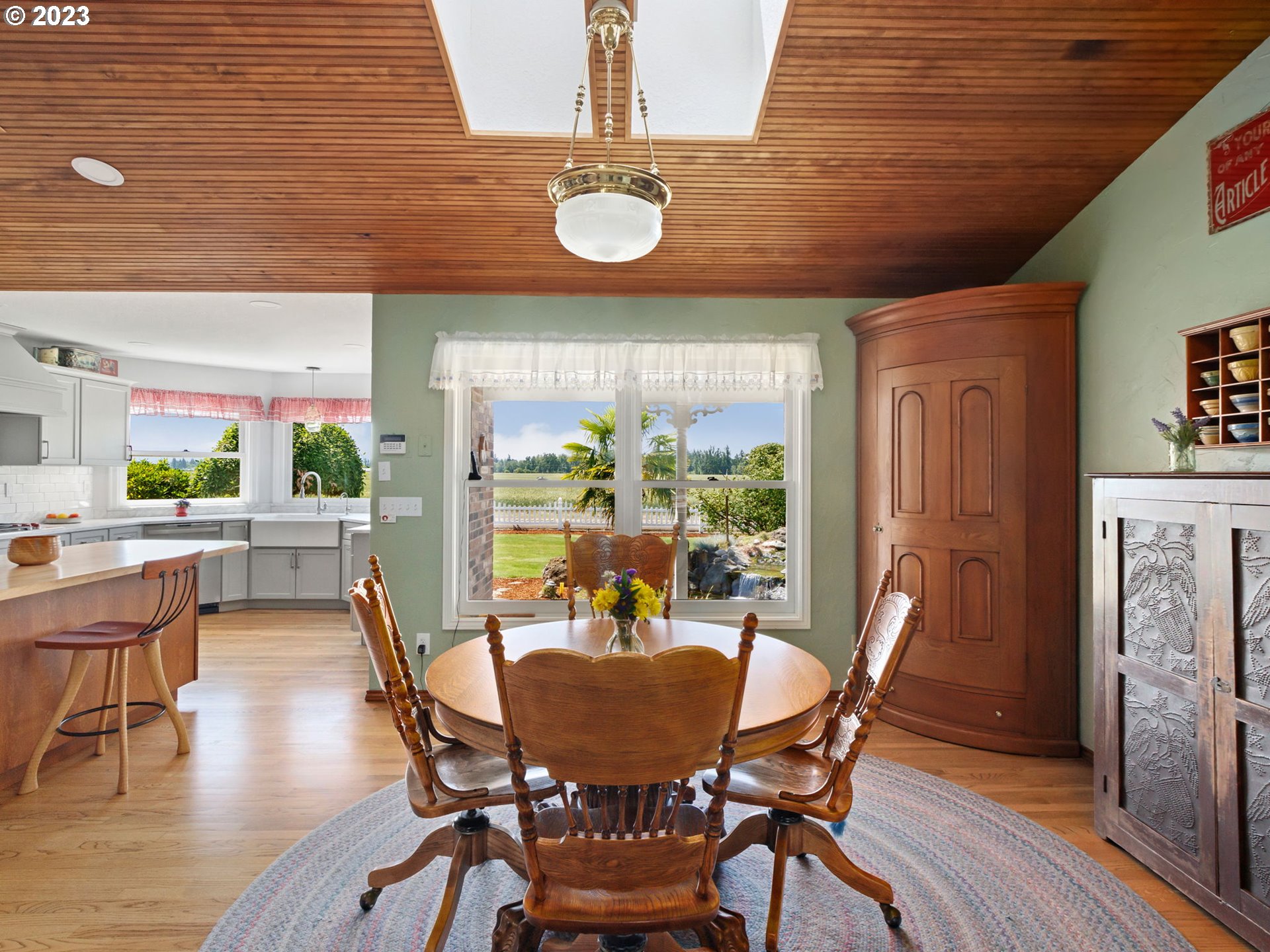 29600 South Dryland Road Canby, OR 97013 - Photo 12 of 48 a view of a dining room with furniture window and wooden floor
