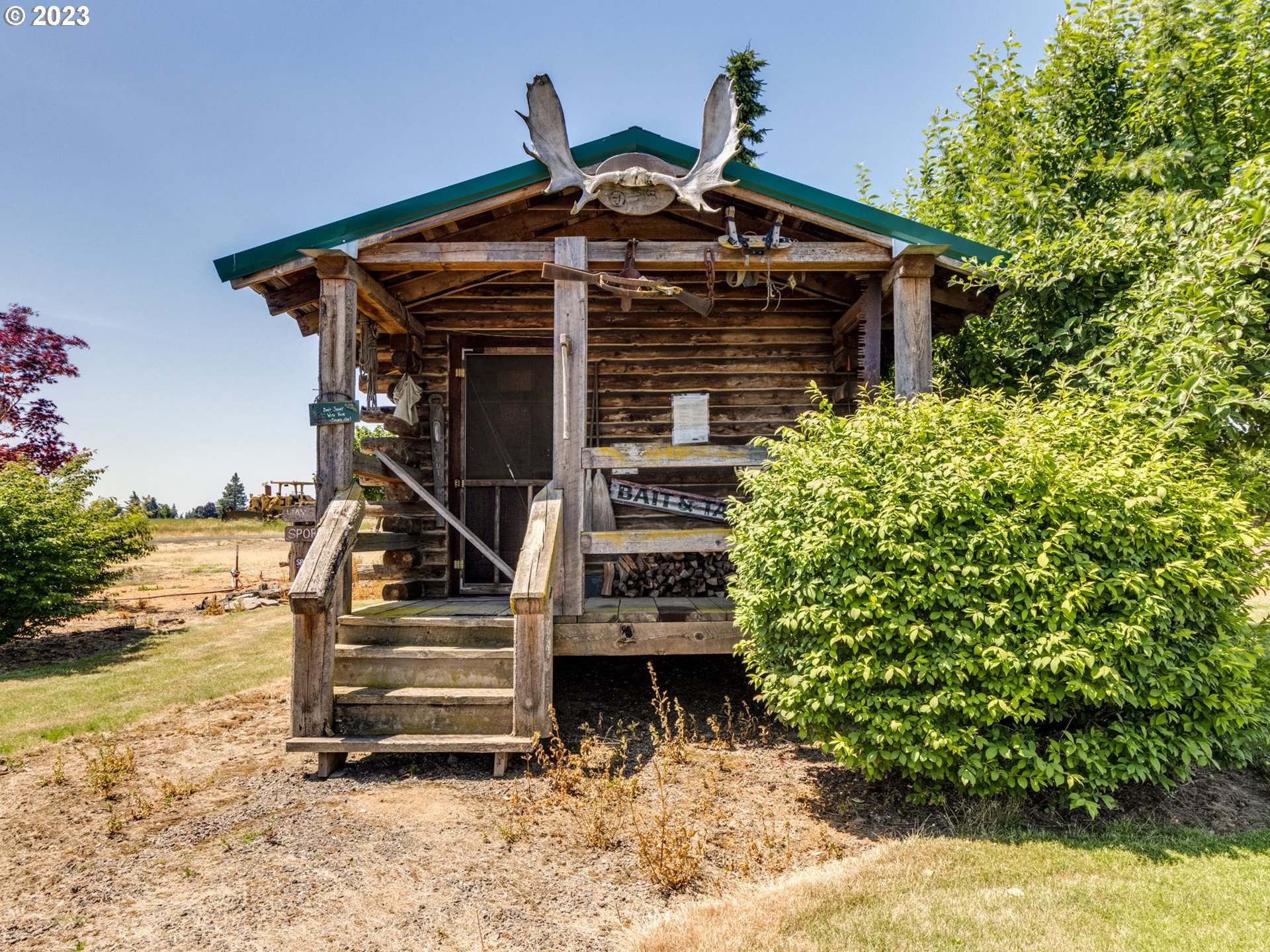 29600 South Dryland Road Canby, OR 97013 - Photo 35 of 48 a view of a house with a small yard and large trees