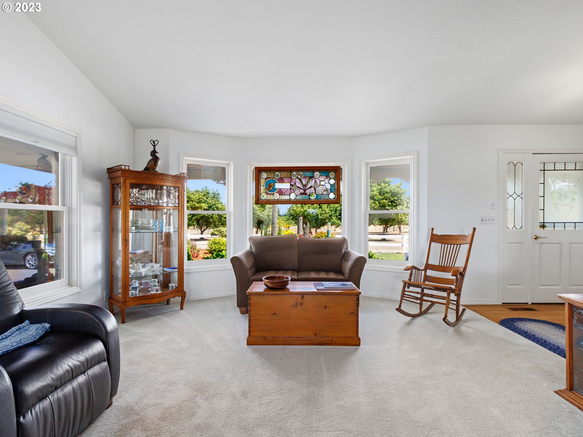 29600 South Dryland Road Canby, OR 97013 - Photo 9 of 48 a living room with furniture and a flat screen tv