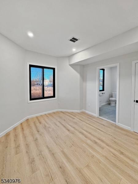 445 Grove Street, Unit 2 Irvington, NJ 07111 - Photo 4 of 11 a view of empty room with wooden floor