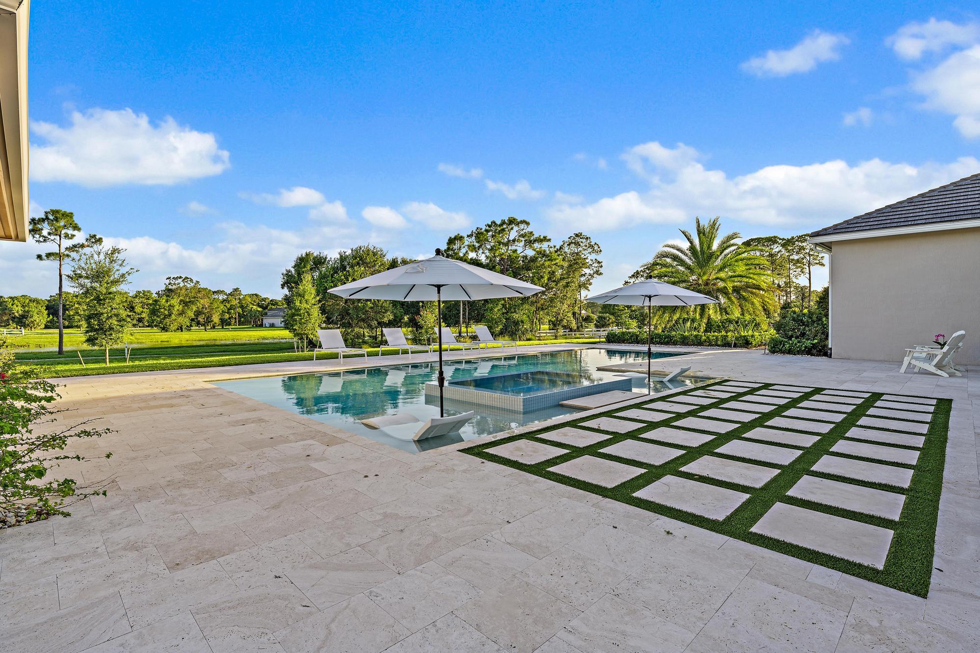 10096 Calabrese Trail Jupiter, FL 33478 - Photo 11 of 58 a view of a park with large trees
