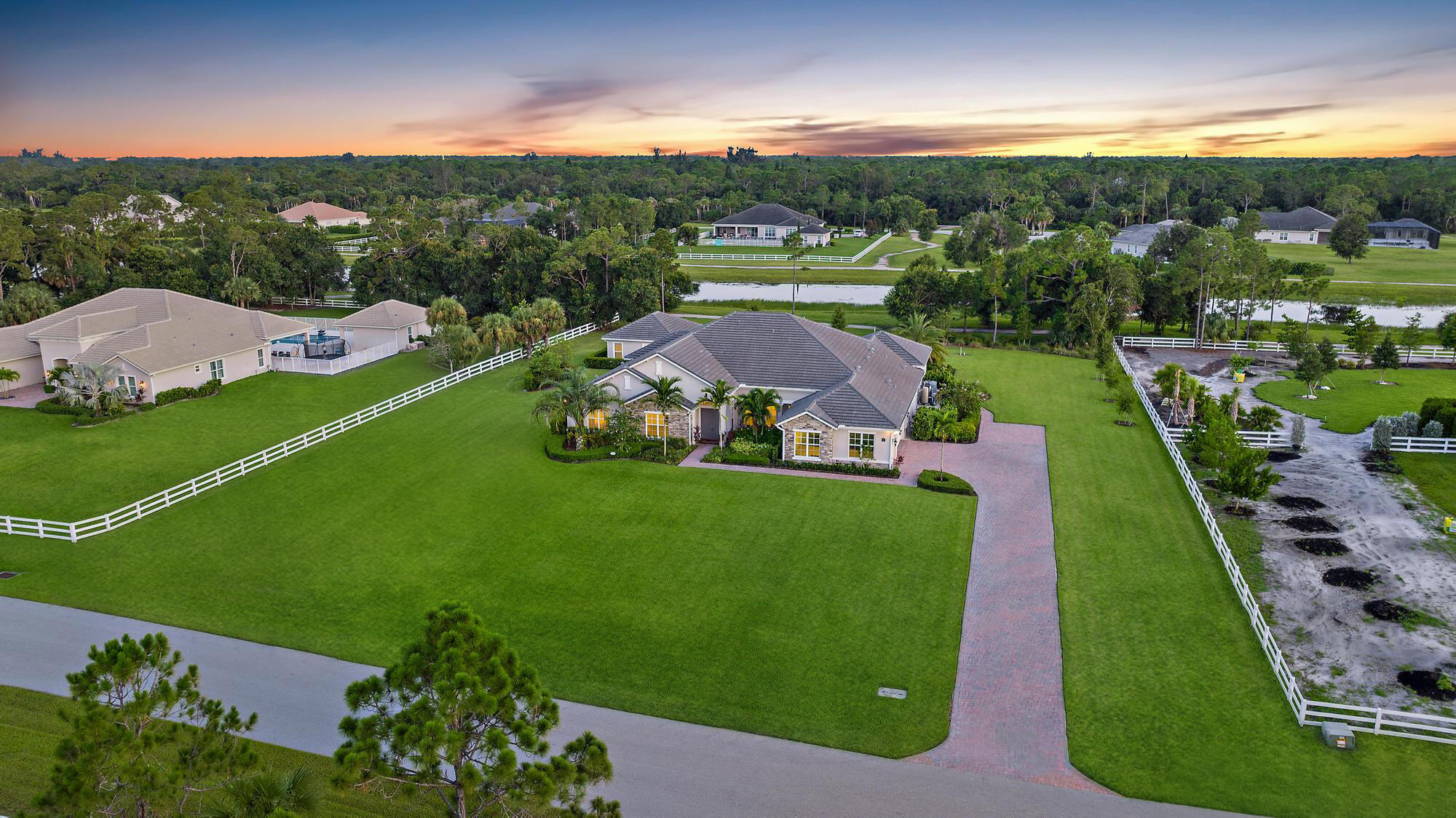 10096 Calabrese Trail Jupiter, FL 33478 - Photo 12 of 58 an aerial view of a houses with outdoor space and garden
