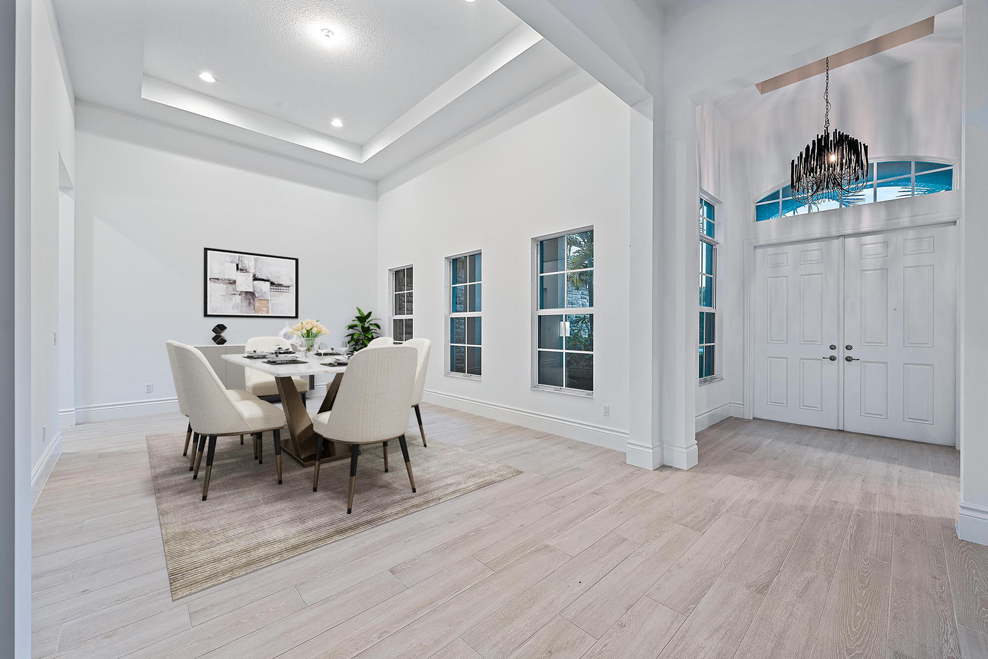 10096 Calabrese Trail Jupiter, FL 33478 - Photo 15 of 58 a view of a dining room with furniture and wooden floor
