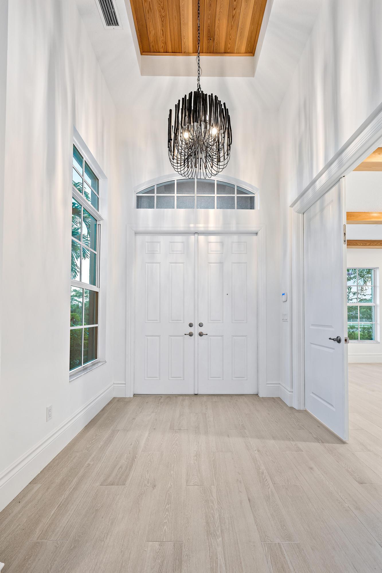 10096 Calabrese Trail Jupiter, FL 33478 - Photo 16 of 58 an empty room with windows