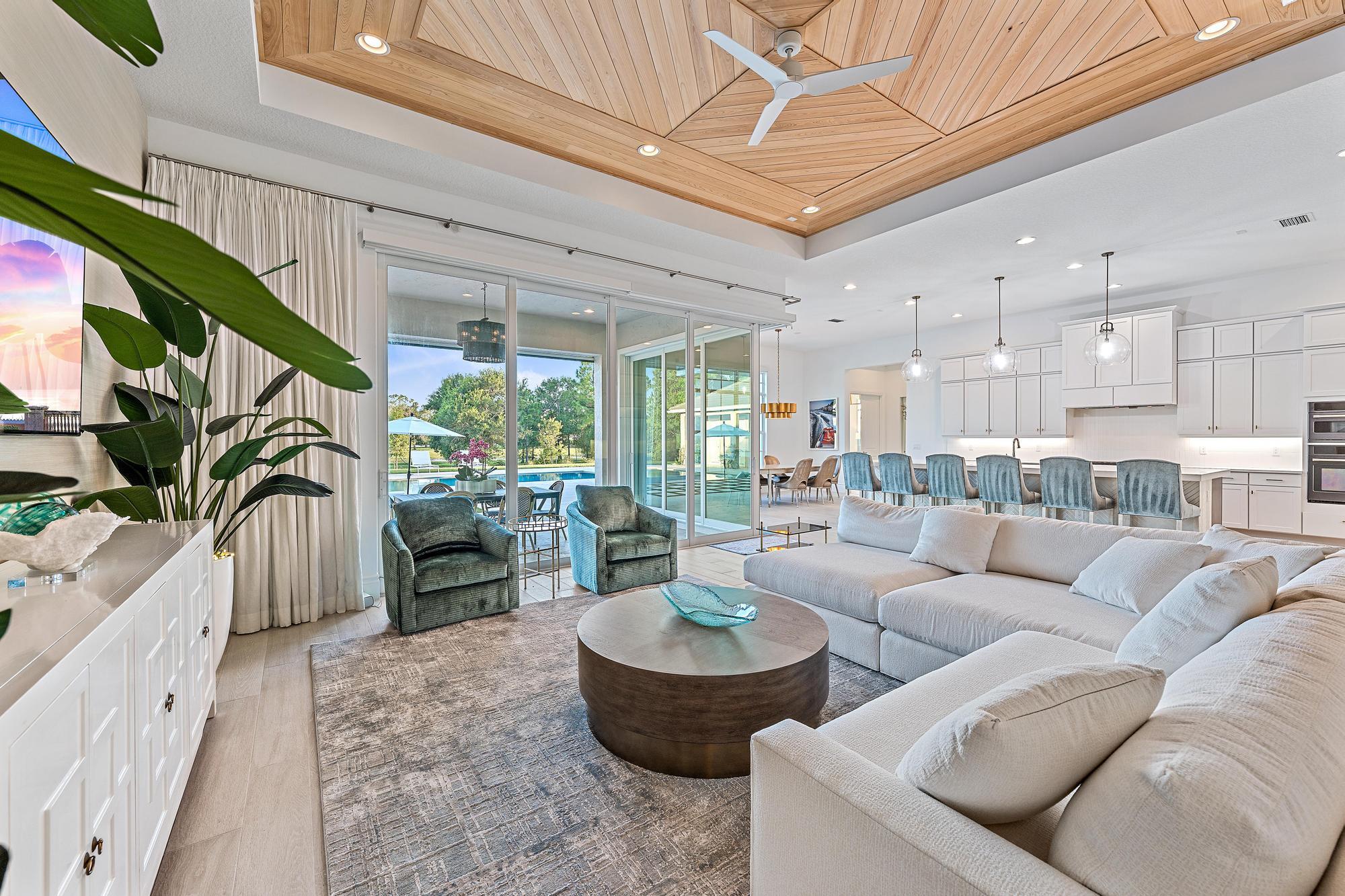 10096 Calabrese Trail Jupiter, FL 33478 - Photo 20 of 58 a living room with furniture and a large window