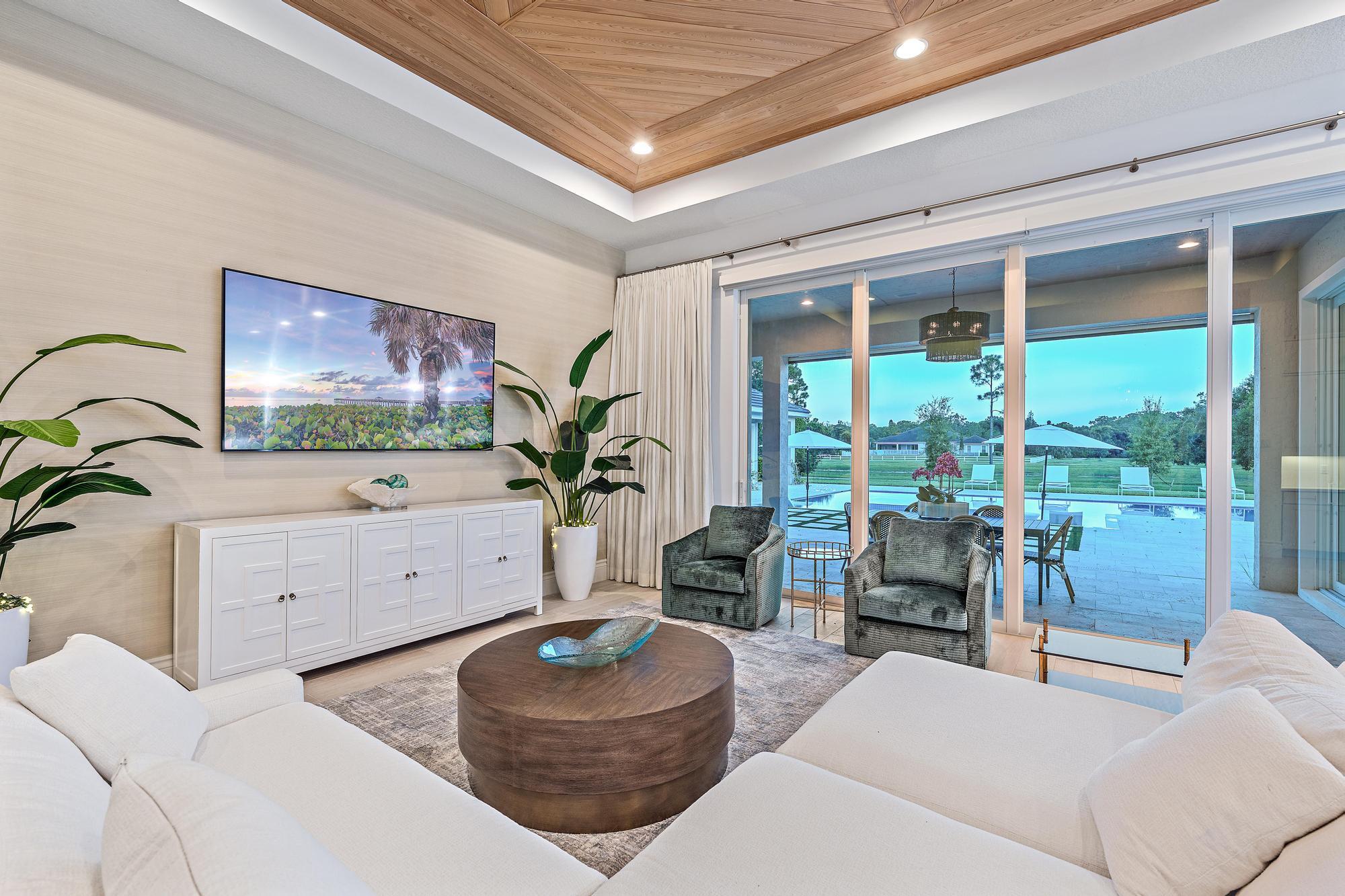 10096 Calabrese Trail Jupiter, FL 33478 - Photo 21 of 58 a living room with furniture and a potted plant