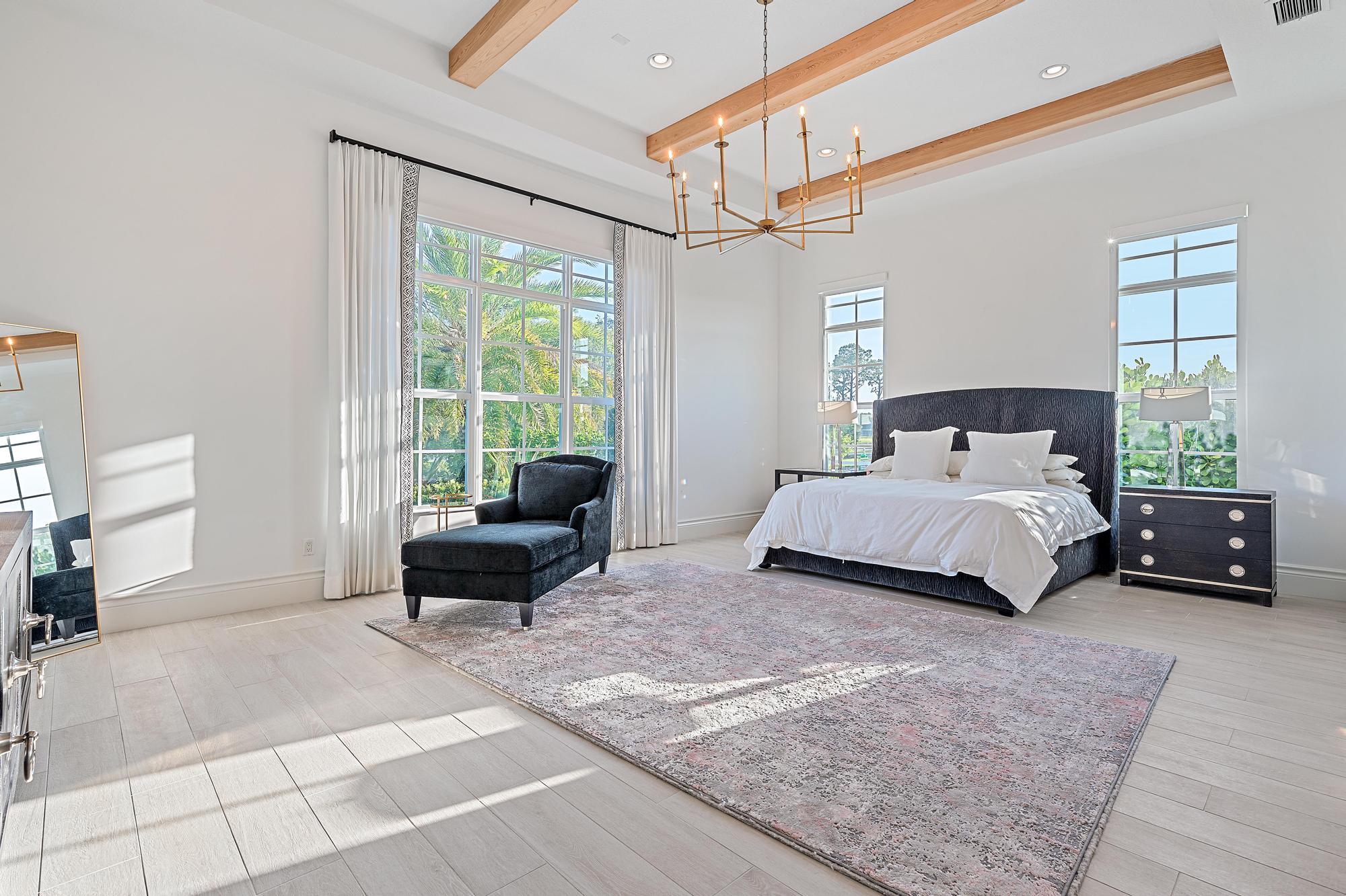 10096 Calabrese Trail Jupiter, FL 33478 - Photo 29 of 58 a bedroom with a bed window and couch