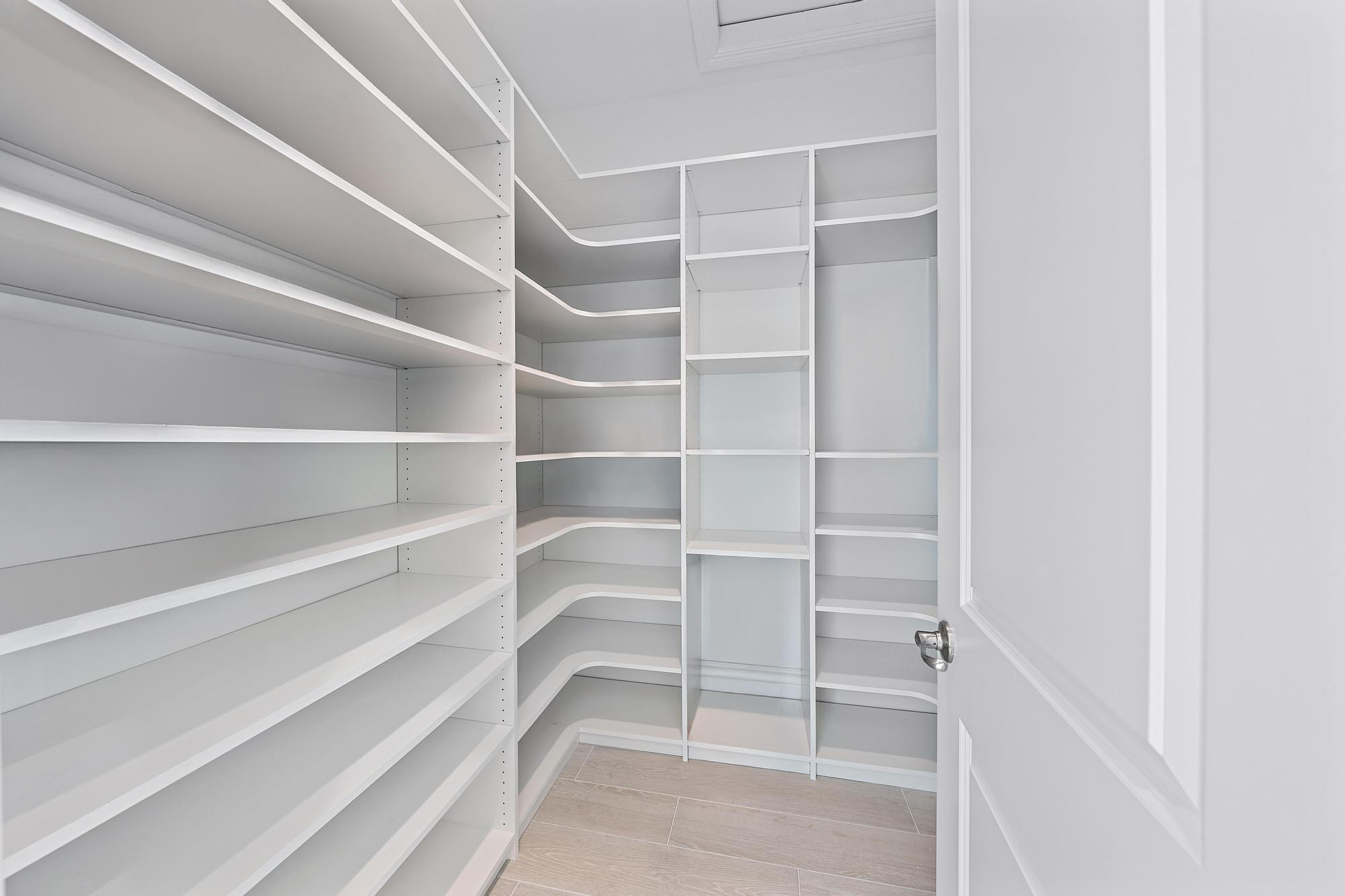 10096 Calabrese Trail Jupiter, FL 33478 - Photo 33 of 58 a view of walk in closet with empty racks