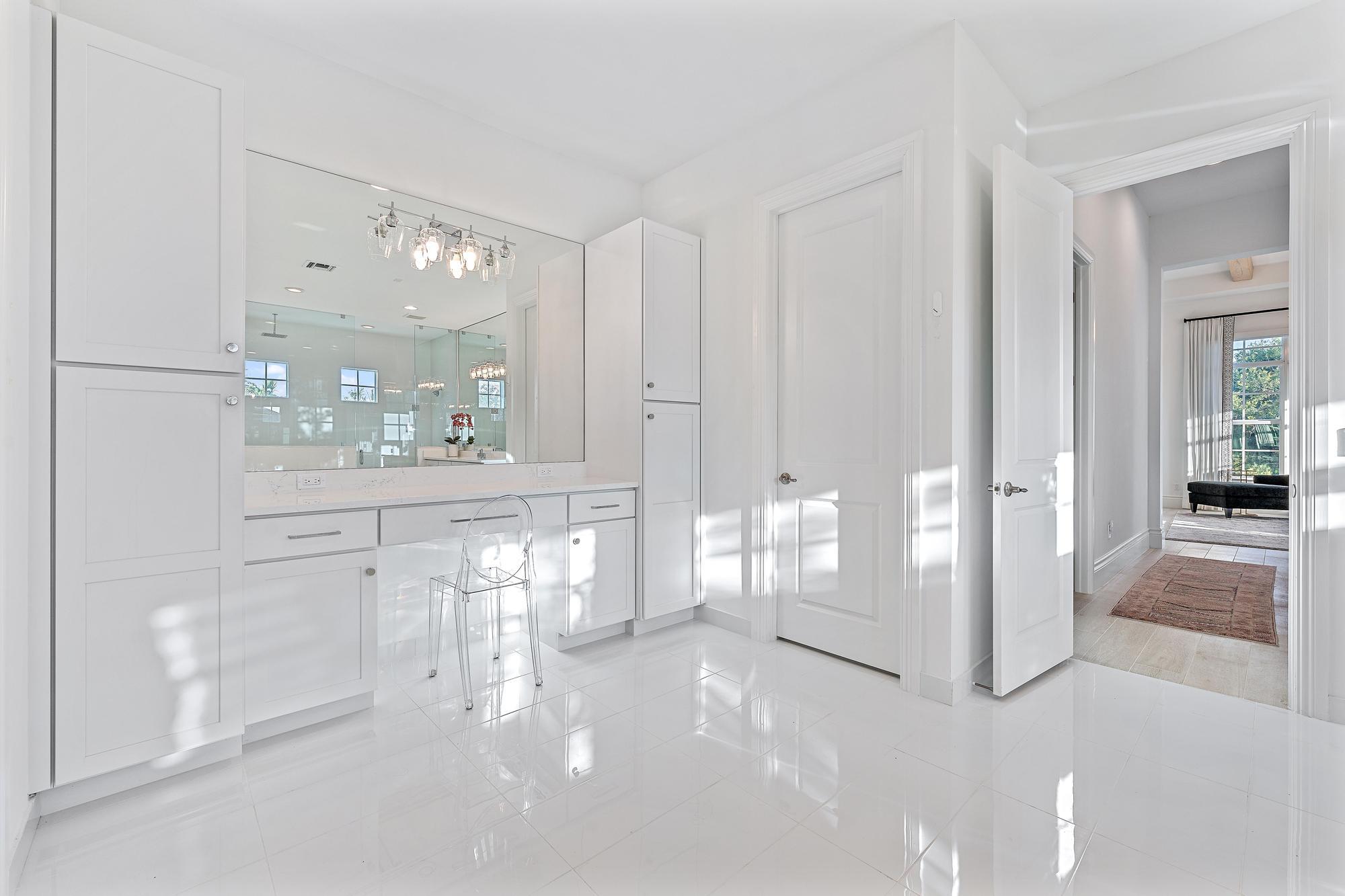 10096 Calabrese Trail Jupiter, FL 33478 - Photo 36 of 58 a view of a bathroom with a glass door shower