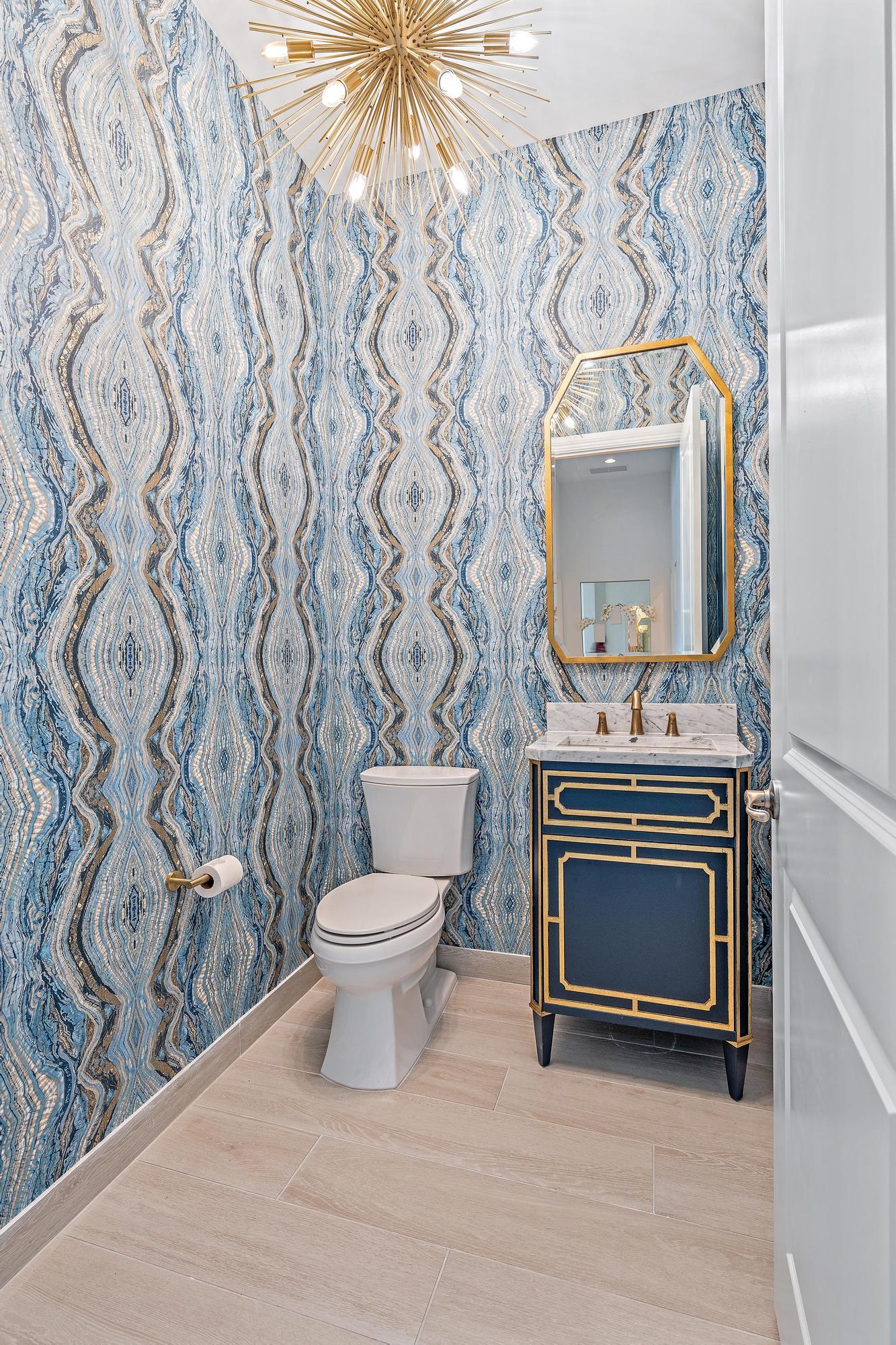 10096 Calabrese Trail Jupiter, FL 33478 - Photo 40 of 58 a living room with a toilet and a fireplace