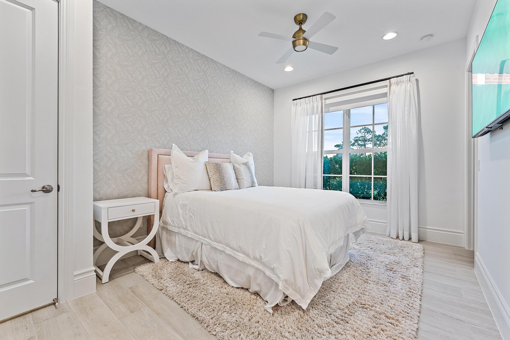 10096 Calabrese Trail Jupiter, FL 33478 - Photo 43 of 58 a bed room with a bed and a window