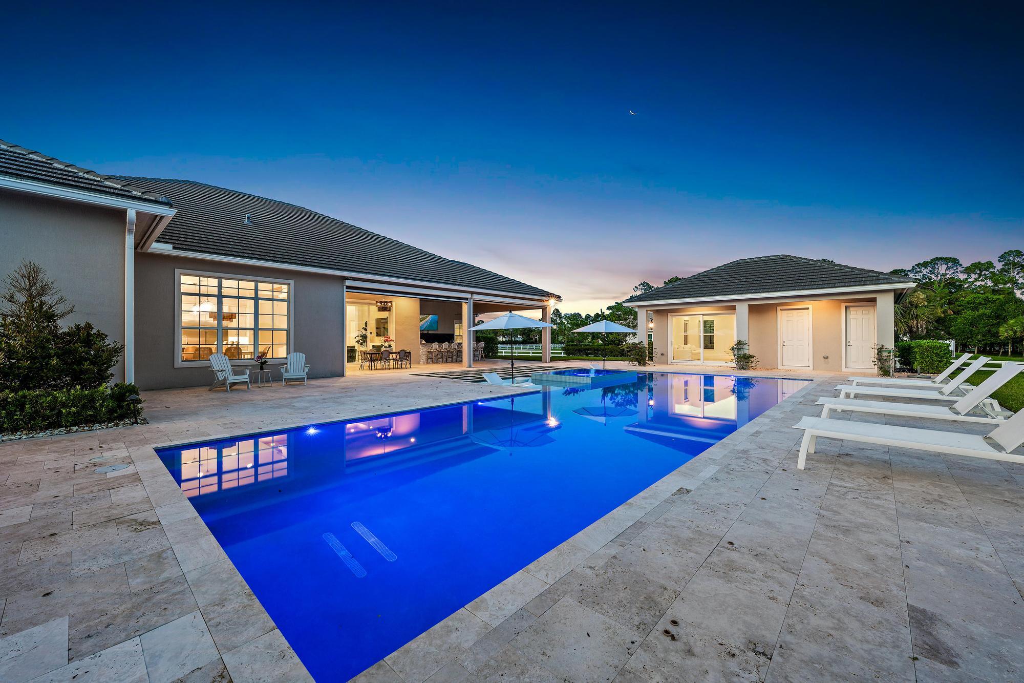10096 Calabrese Trail Jupiter, FL 33478 - Photo 5 of 58 swimming pool with outdoor seating