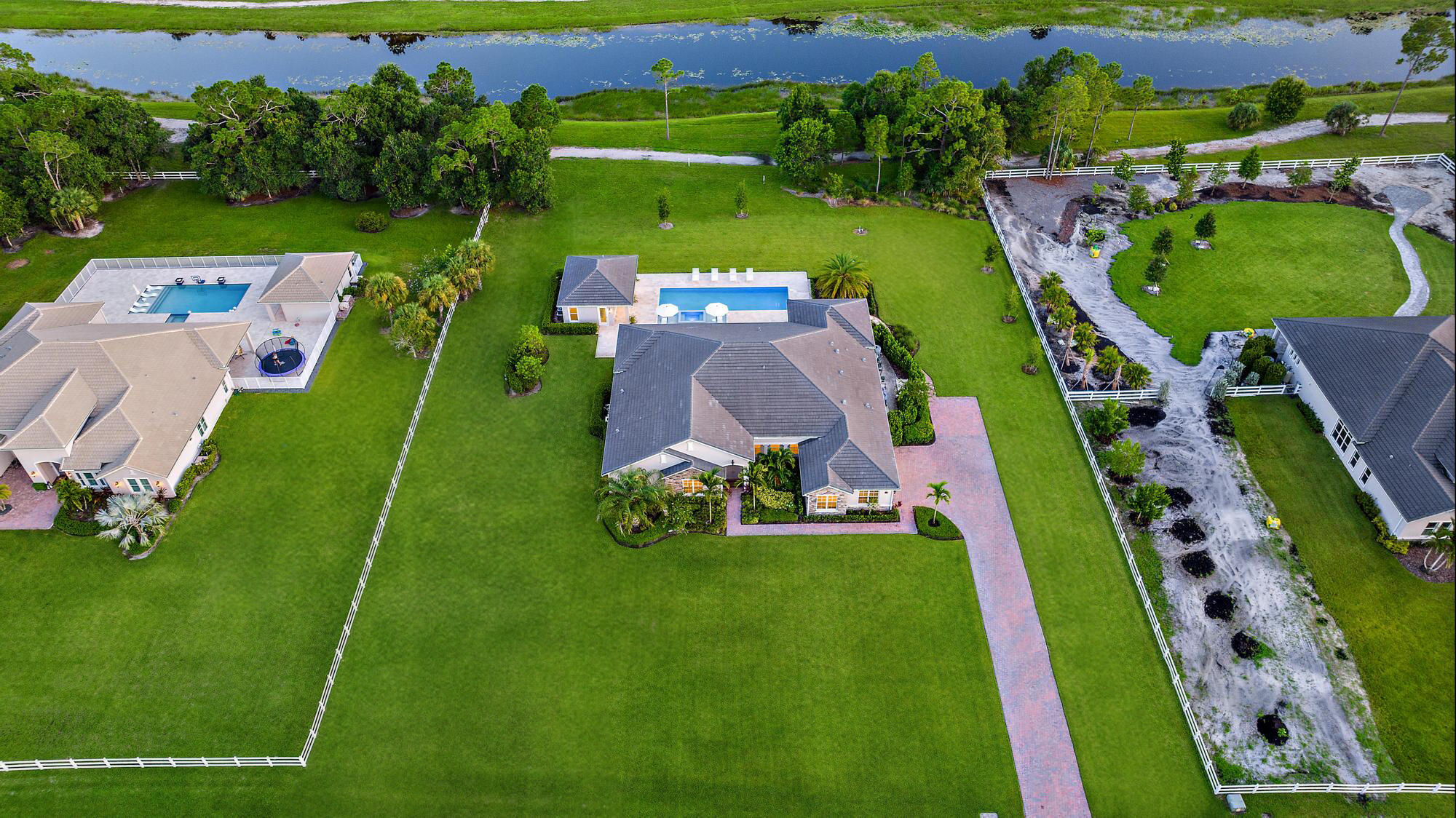 10096 Calabrese Trail Jupiter, FL 33478 - Photo 53 of 58 an aerial view of a golf course with chairs