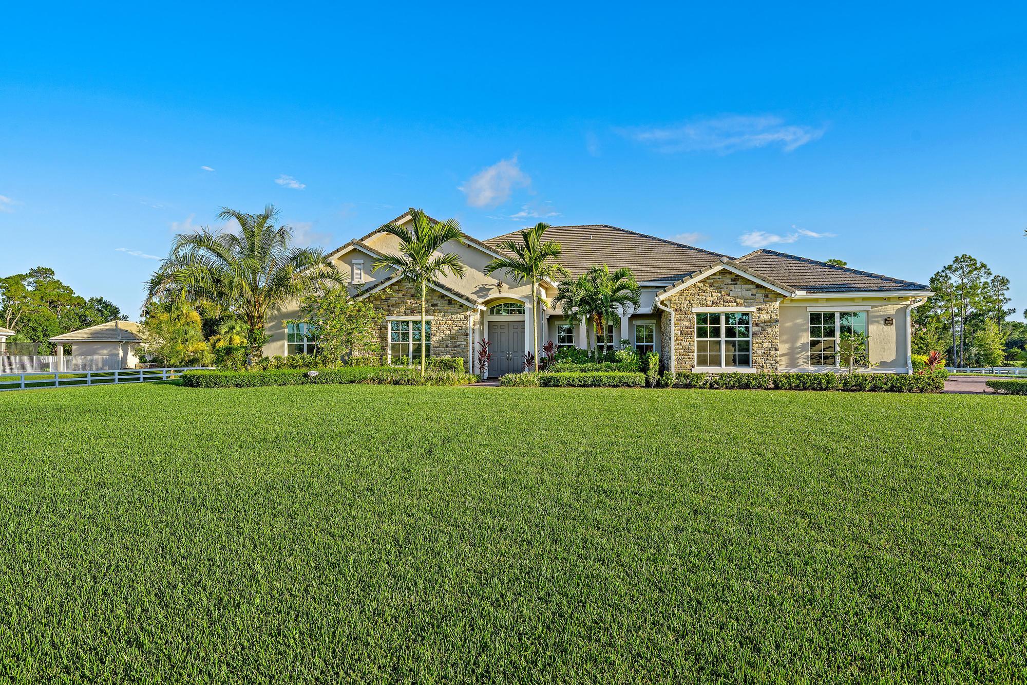 10096 Calabrese Trail Jupiter, FL 33478 - Photo 55 of 58 a view of house with garden