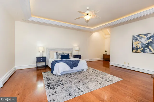 a bedroom with a bed and a couch