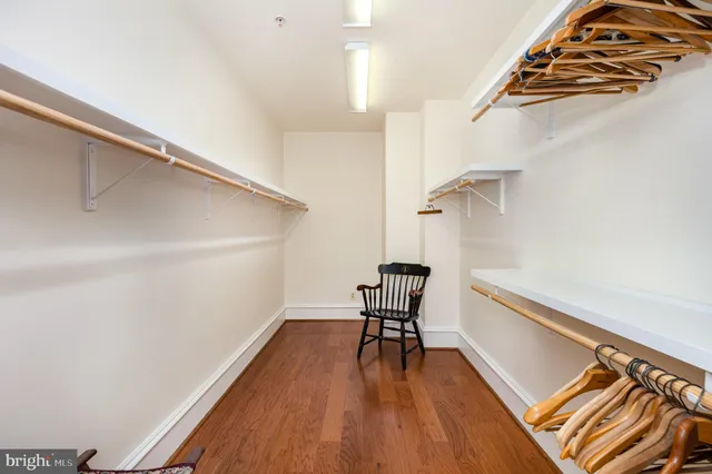 a bedroom with a bed and a workspace