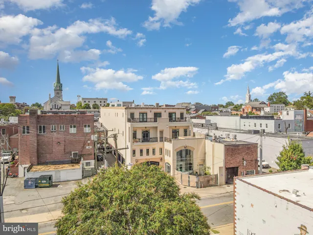 a view of a building with sitting area