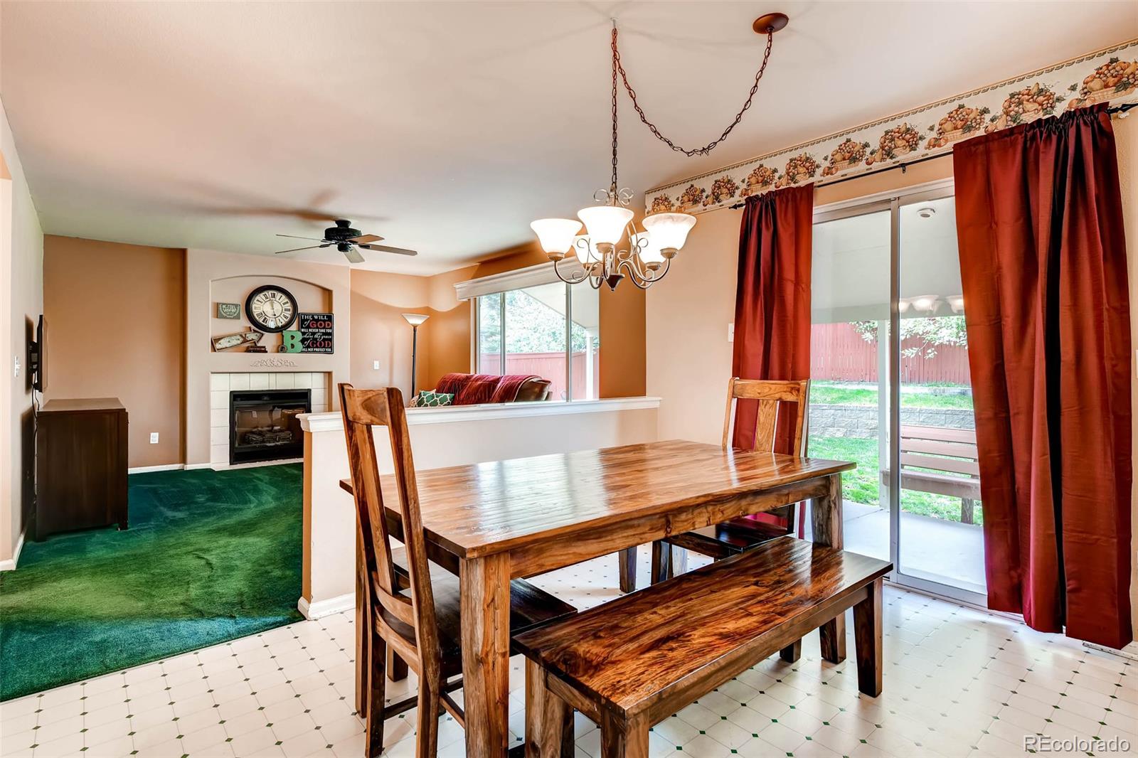 9645 South Castle Ridge Circle Highlands Ranch, CO 80129 - Photo 11 of 28 a view of a dining room with furniture window and wooden floor