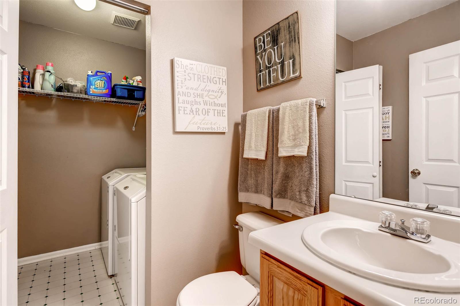 9645 South Castle Ridge Circle Highlands Ranch, CO 80129 - Photo 20 of 28 a bathroom with a sink toilet and shower