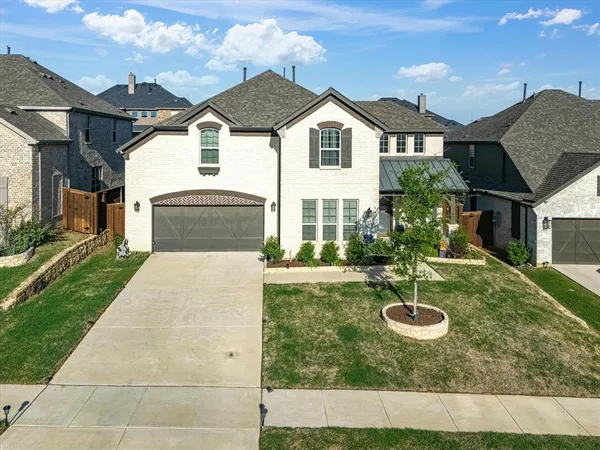 a front view of a house with yard