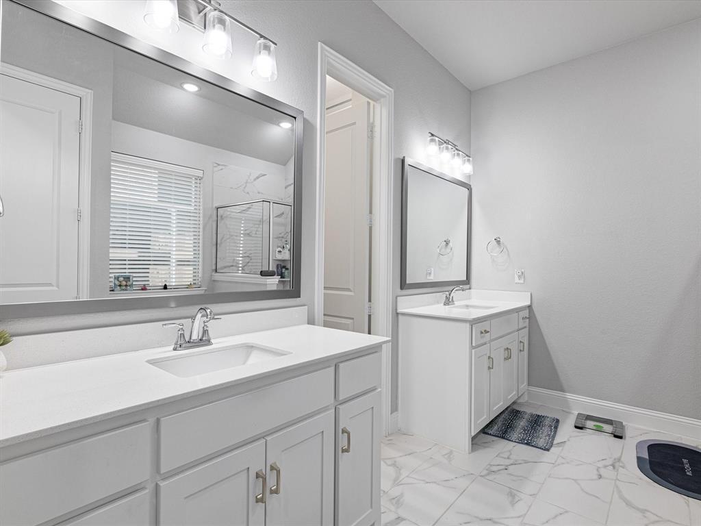 1606 Evening Primrose Drive Mansfield, TX 76063 - Photo 16 of 36 a bathroom with a sink and a mirror