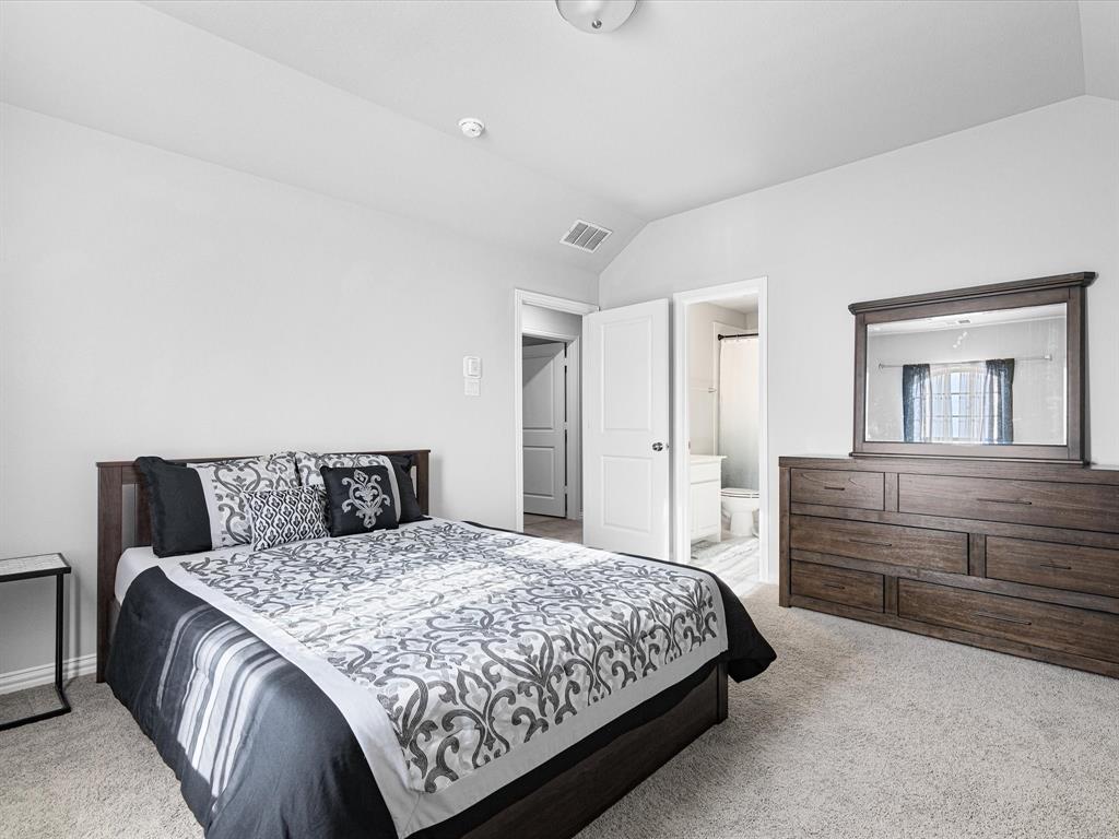 1606 Evening Primrose Drive Mansfield, TX 76063 - Photo 19 of 36 a bedroom with a bed and a dresser