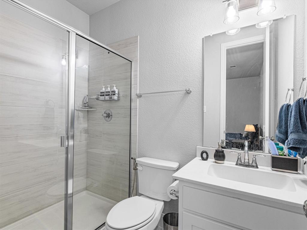 1606 Evening Primrose Drive Mansfield, TX 76063 - Photo 21 of 36 a bathroom with a sink a toilet and shower