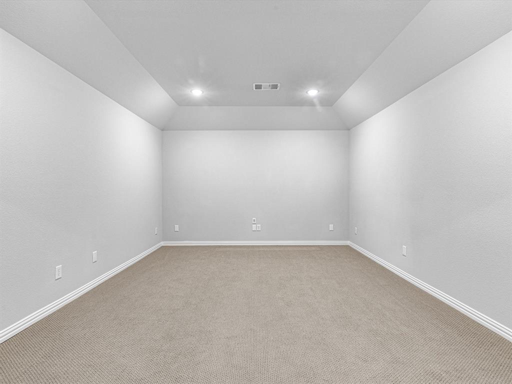 1606 Evening Primrose Drive Mansfield, TX 76063 - Photo 27 of 36 an empty room with a empty space and windows
