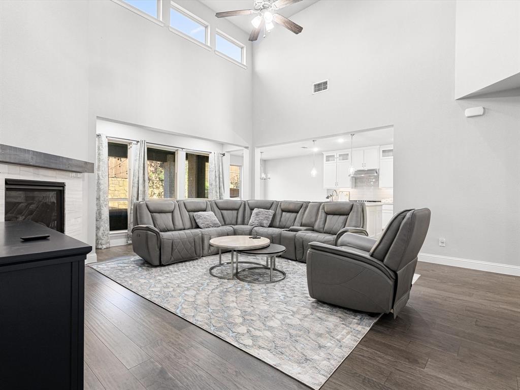 1606 Evening Primrose Drive Mansfield, TX 76063 - Photo 7 of 36 a living room with furniture and a fireplace