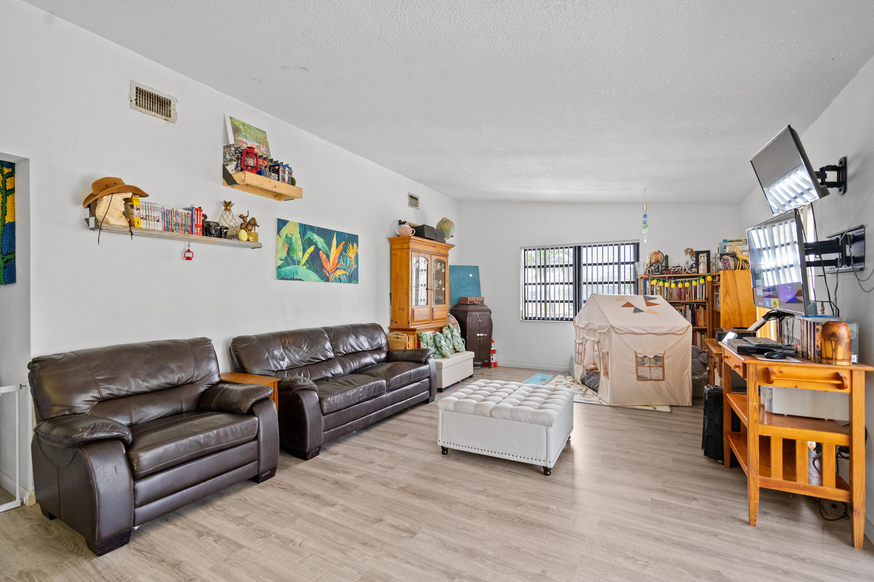 778 Canal Street Key Largo, FL 33037 - Photo 14 of 34 a living room with furniture and a wooden floor