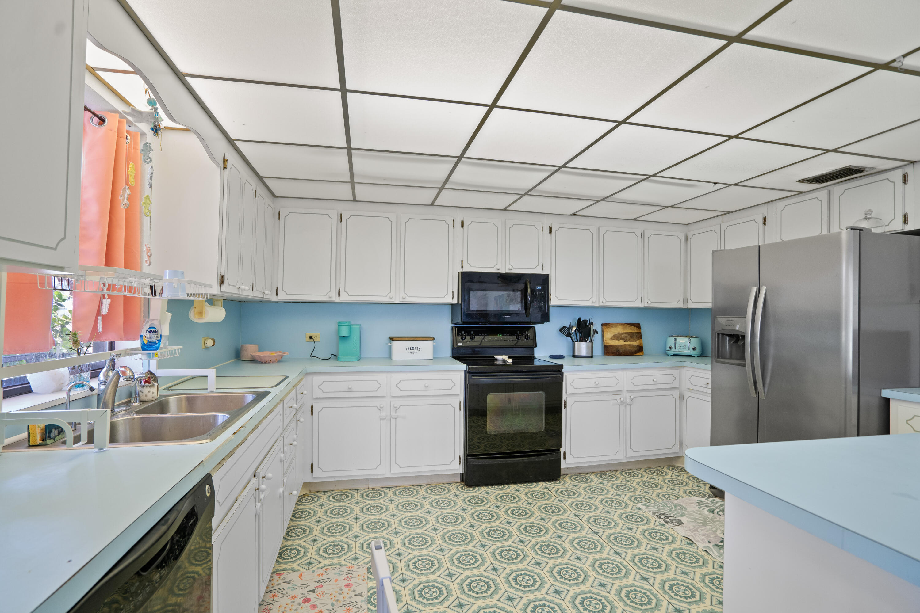 778 Canal Street Key Largo, FL 33037 - Photo 17 of 34 a kitchen with stainless steel appliances and a sink